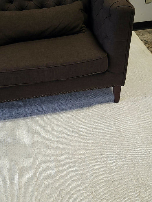 Tufted Brown Sofa with Antique Brass Nailhead Trim
